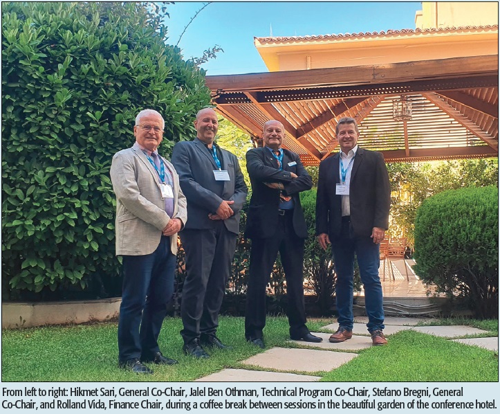 From left to right: Hikmet Sari, General Co-Chair, Jalel Ben Othman, Technical Program Co-Chair, Stefano Bregni, General Co-Chair, and Rolland Vida, Finance Chair, during a coffee break between sessions in the beautiful garden of the conference hotel.