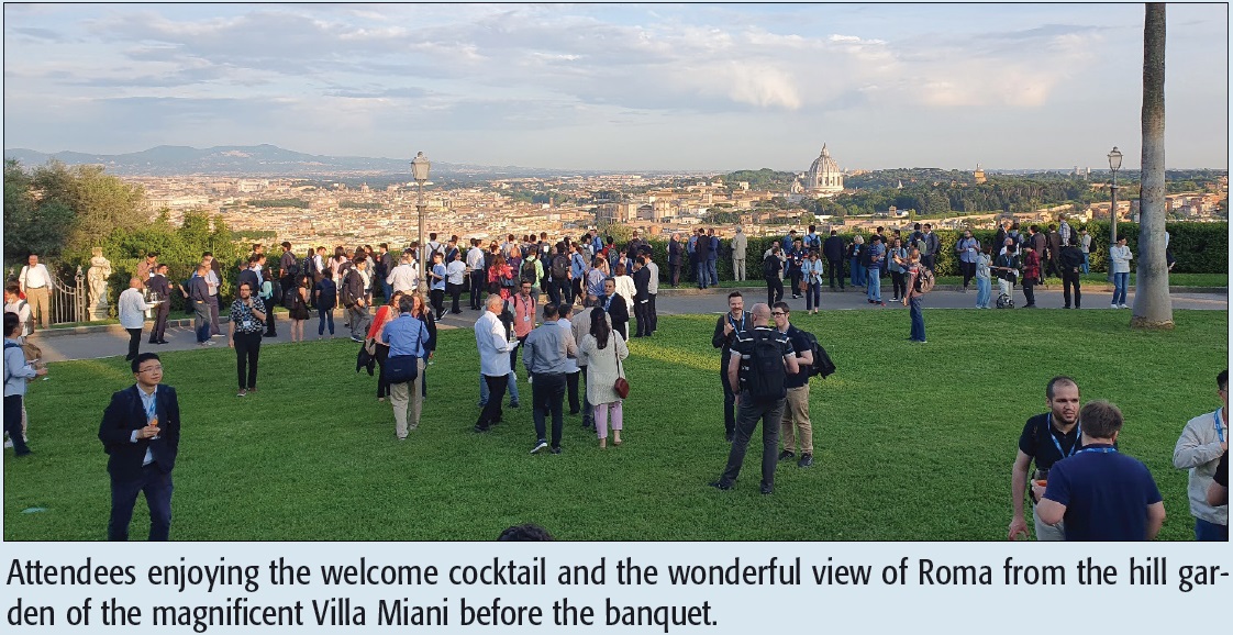 Attendees enjoying the welcome cocktail and the wonderful view of Roma from the hill garden of the magnificent Villa Miani before the banquet.