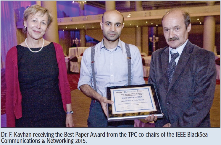 Dr. F. Kayhan receiving the Best Paper Award from the TPC co-chairs of the IEEE BlackSea Communications & Networking 2015.