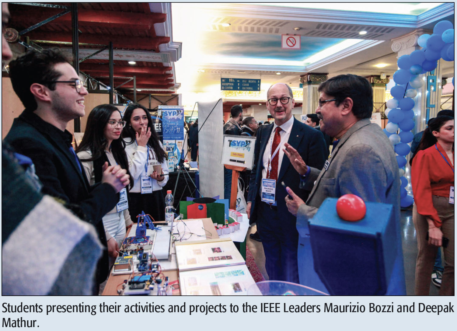 Students presenting their activities and projects to the IEEE Leaders Maurizio Bozzi and Deepak Mathur.