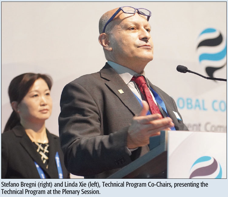 Stefano Bregni (right) and Linda Xie (left), Technical Program Co-Chairs, presenting the Technical Program at the Plenary Session.