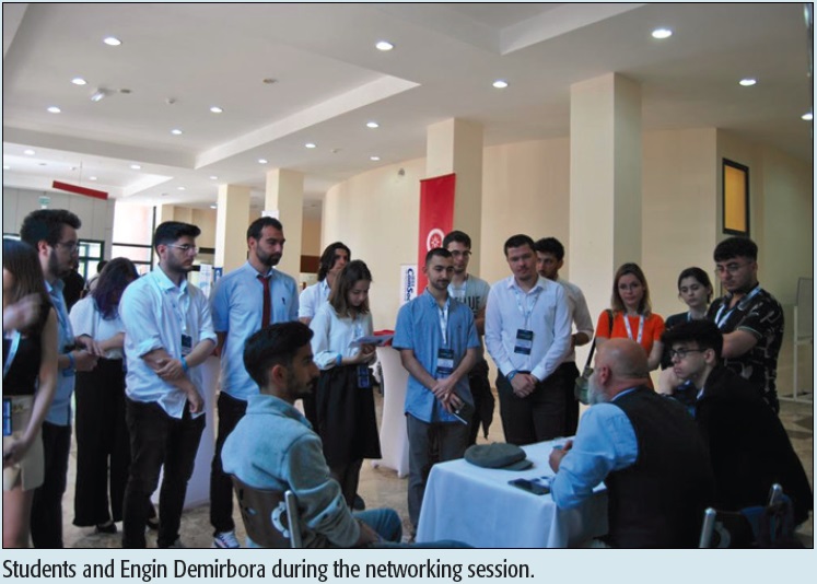 Students and Engin Demirbora during the networking session.