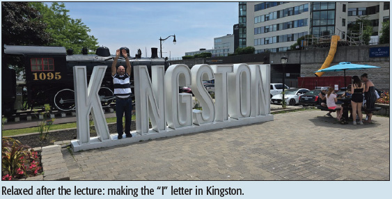 Relaxed after the lecture: making the “I” letter in Kingston.