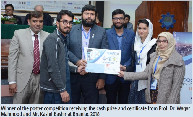 Winner of the poster competition receiving the cash prize and certificate from Prof. Dr. Waqar Mahmood and Mr. Kashif Bashir at Brianiac 2018.